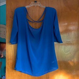 Royal blue blouse with low cut back